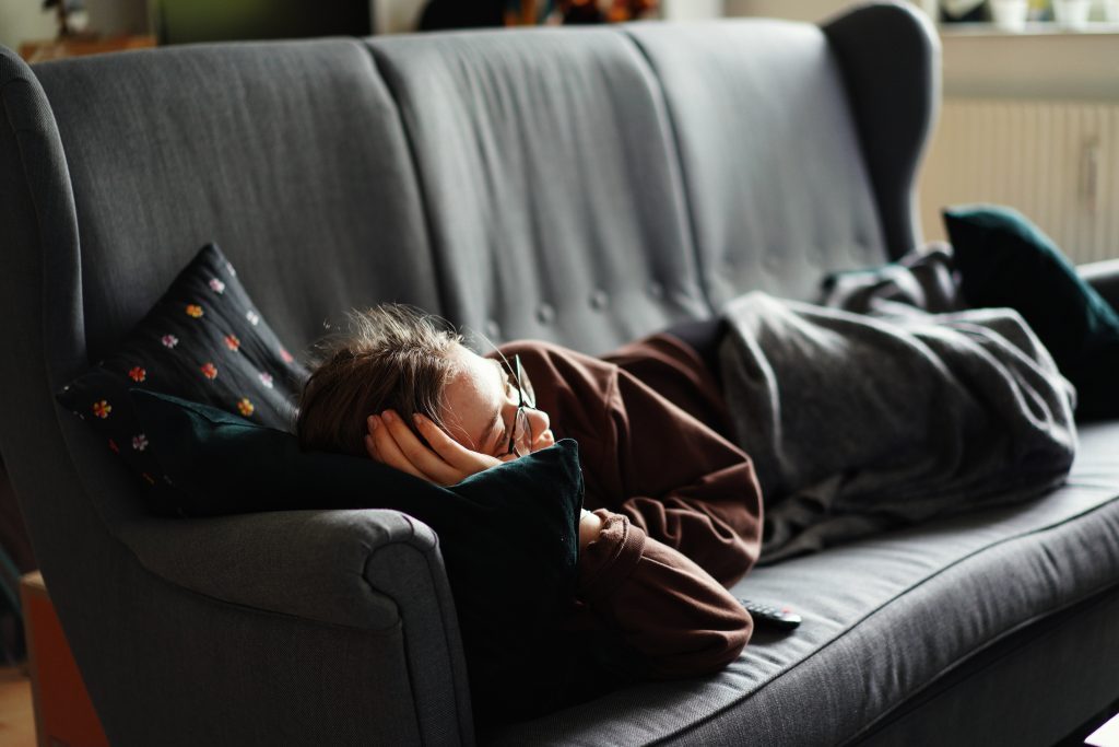 A woman lying on a couch