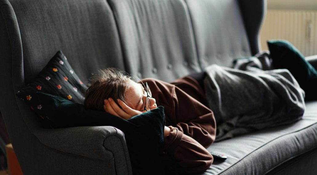 A woman lying on a couch