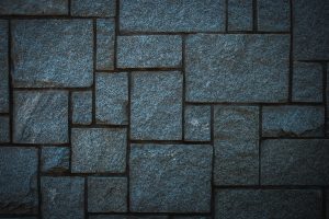 A close up of a wall made of stone blocks