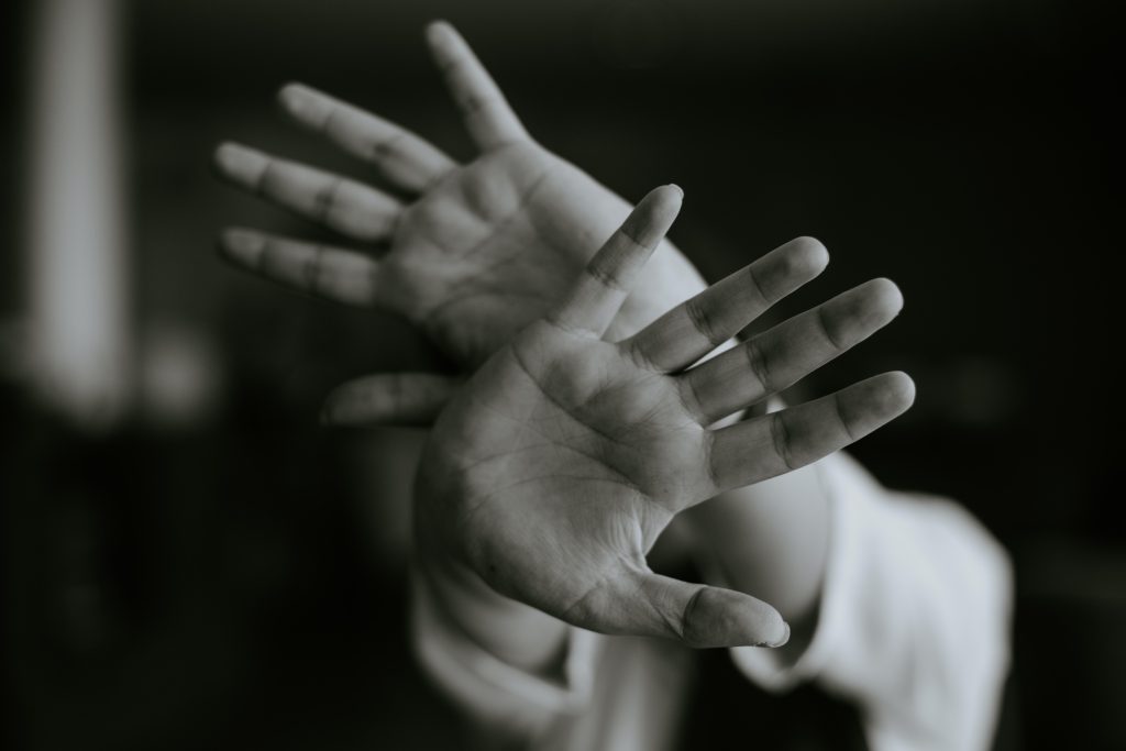 A person stretching his hand