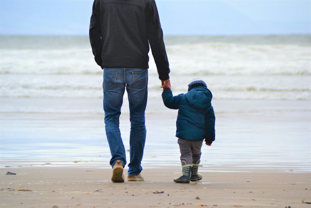 Dad and son on a beach
