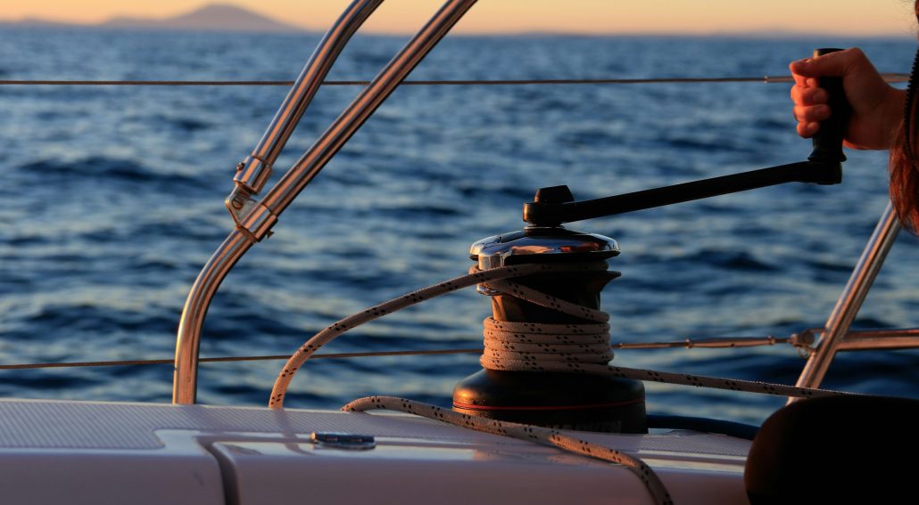 Sailing rope and winch at sunset on the ocean