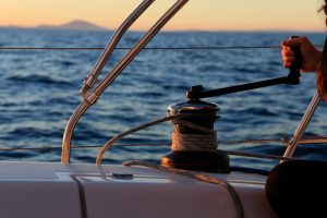Sailing rope and winch at sunset on the ocean