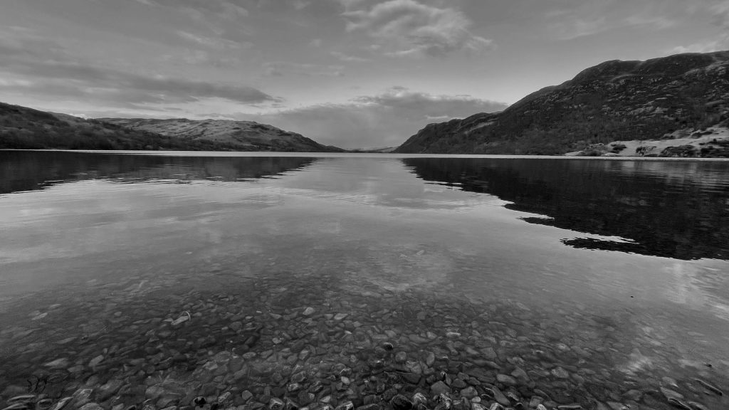 Black and white photo of a calm lake