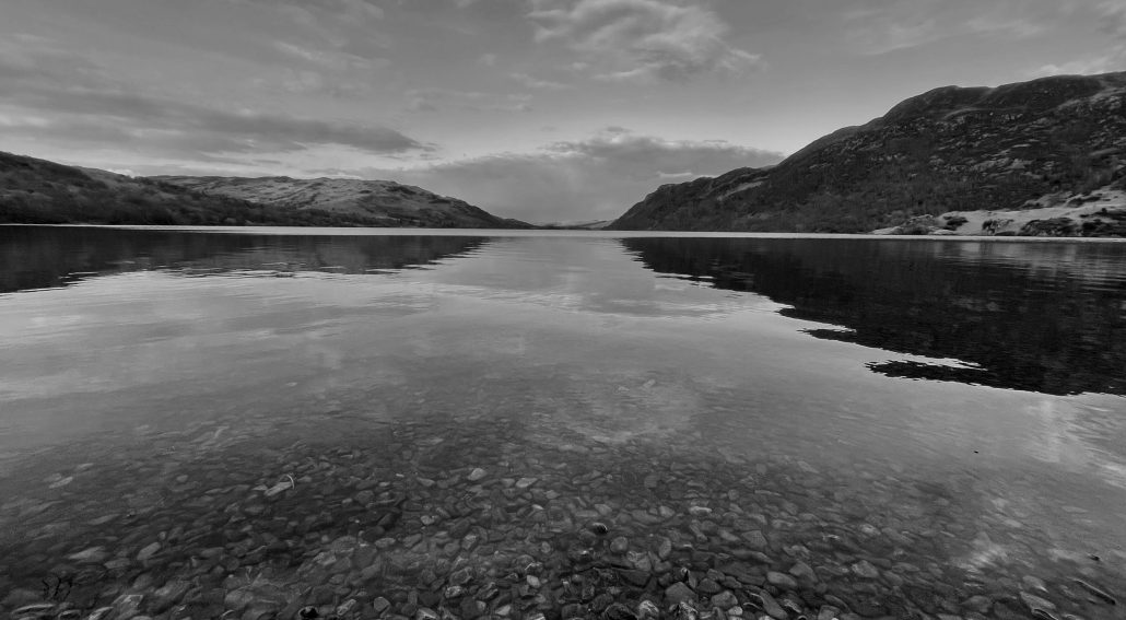 Black and white photo of a calm lake