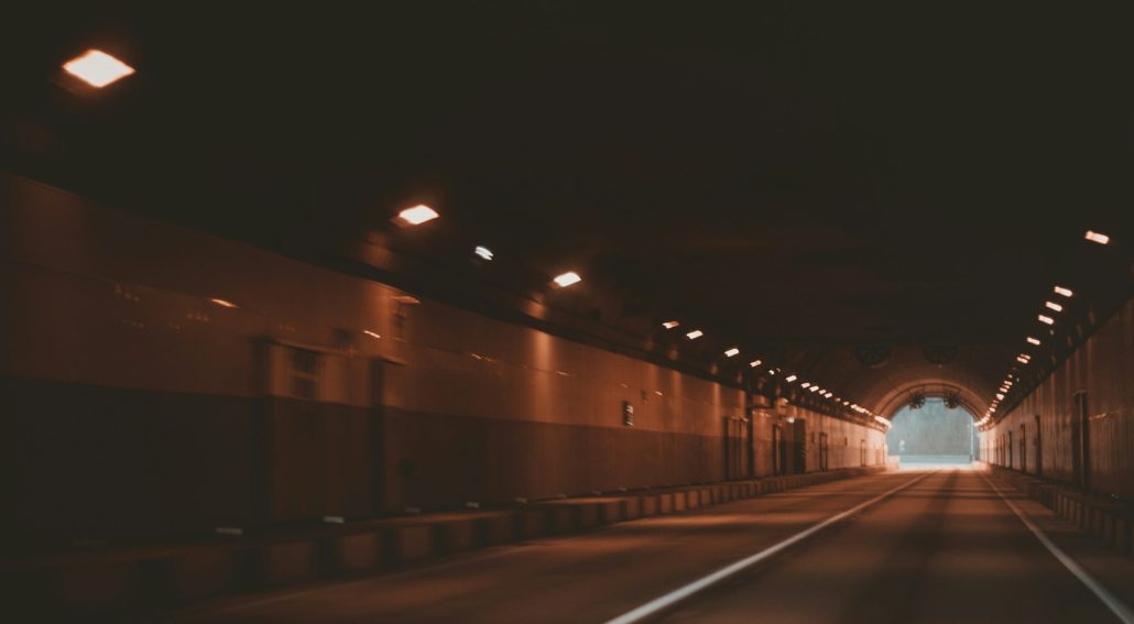 Tunnel leading to an open natural light