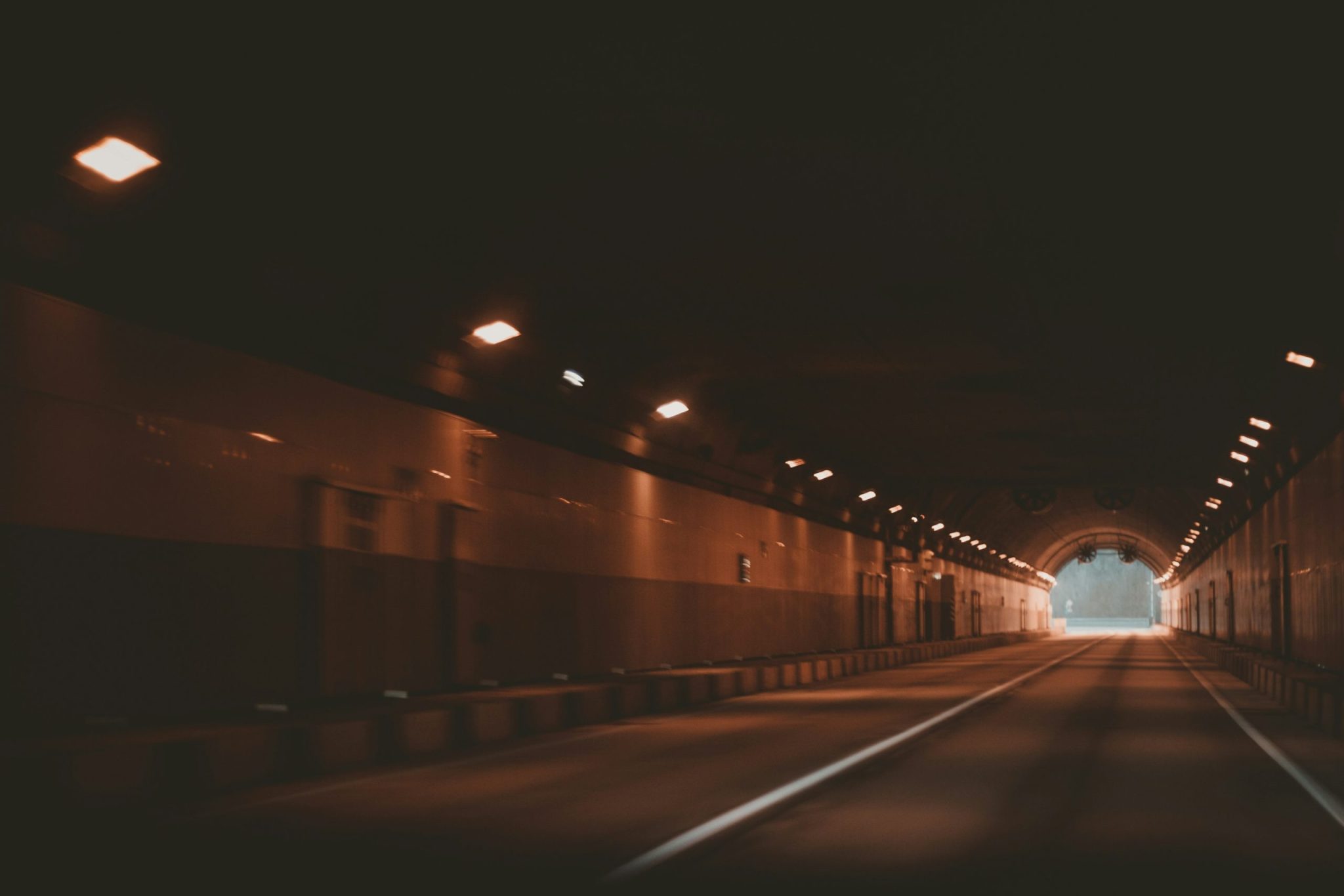 Tunnel leading to an open natural light