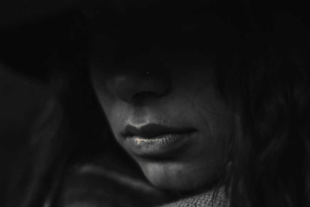 Close-up of a person's face in shadow