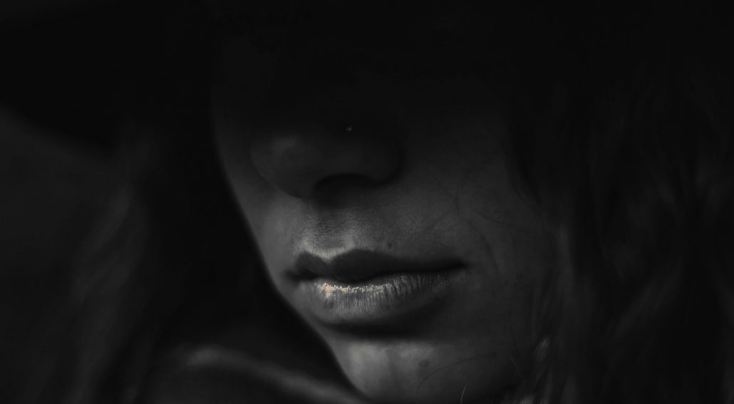 Close-up of a person's face in shadow