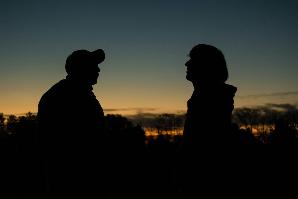 Silhouette of a man and woman during sunset