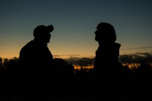 Silhouette of a man and woman during sunset