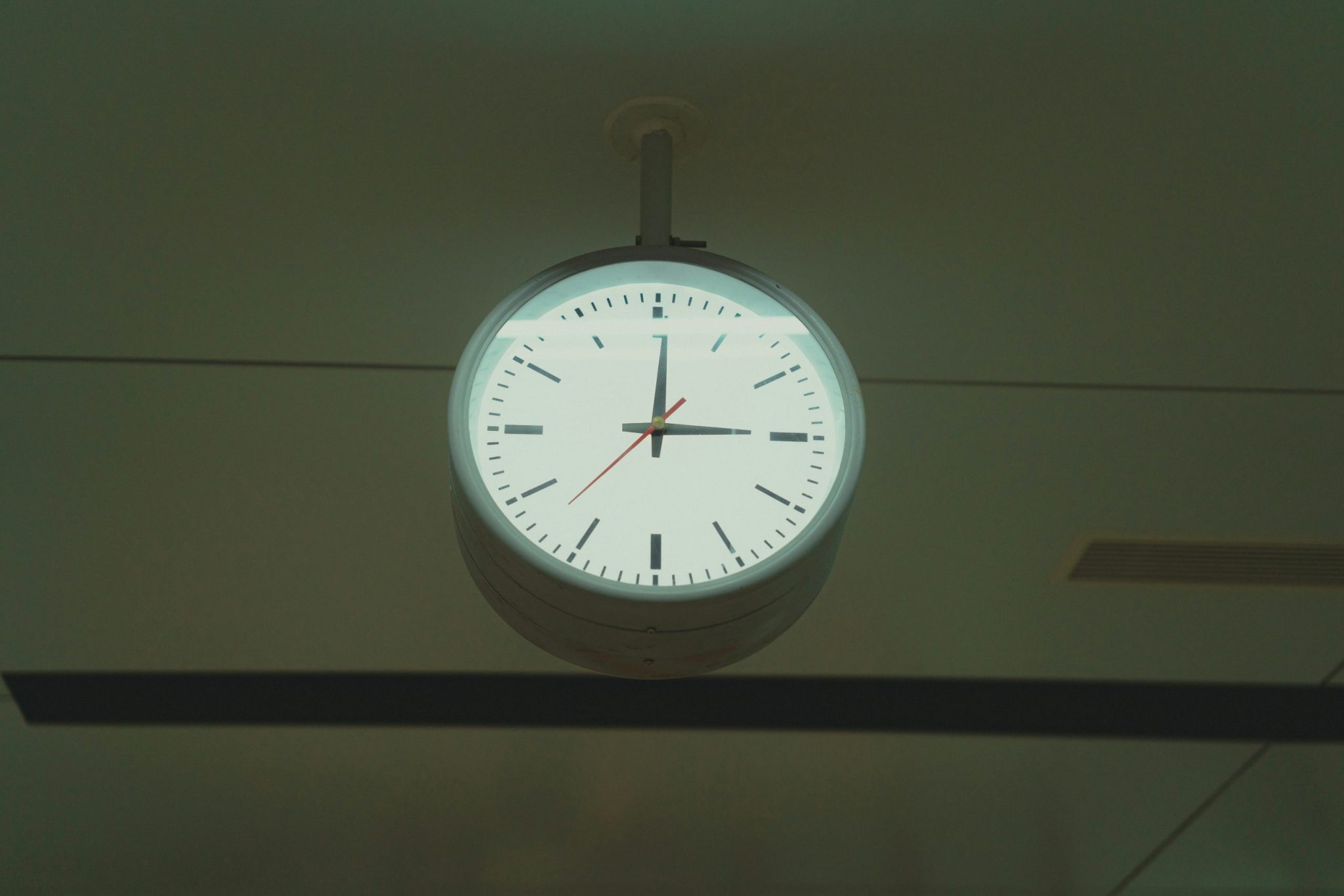 Clock hanging on a ceiling